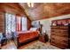 Comfortable bedroom featuring wood walls, hardwood floors, and a cozy ambiance at 181 Halfway Rd., Nichols, SC 29581