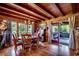 Charming dining room with wood floors, a chandelier, and sliding door access to the outdoors at 181 Halfway Rd., Nichols, SC 29581