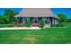 Charming home exterior with a metal roof, covered front porch, and well-manicured landscaping at 181 Halfway Rd., Nichols, SC 29581
