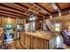 Open kitchen with a large island, wood cabinets, stainless steel appliances, and hardwood floors at 181 Halfway Rd., Nichols, SC 29581