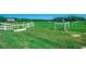 Open green pastures of land welcome you through fenced areas to the property with multiple structures at 181 Halfway Rd., Nichols, SC 29581