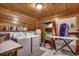 Laundry room featuring washer and dryer, storage shelf, ironing board, and tiled floor at 181 Halfway Rd., Nichols, SC 29581