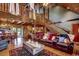 Open-concept living area with wood floors, comfortable seating, and view of the dining area and kitchen at 181 Halfway Rd., Nichols, SC 29581