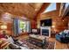 Inviting living room features wood paneling, a fireplace, and comfortable seating at 181 Halfway Rd., Nichols, SC 29581