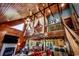 Stunning living room with wood finishes, a loft, and an open view to the dining and kitchen areas at 181 Halfway Rd., Nichols, SC 29581