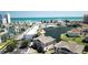 Aerial view of a coastal community with a serene pond, surrounded by lush landscaping and beach views at 1900 Duffy St. # L-5, North Myrtle Beach, SC 29582