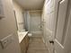 Bright bathroom with a vanity, toilet, and shower/tub combo with a neutral shower curtain at 1900 Duffy St. # L-5, North Myrtle Beach, SC 29582