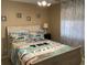 Cozy bedroom featuring beach-themed decor, a queen bed, and light-filtering curtains at 1900 Duffy St. # L-5, North Myrtle Beach, SC 29582
