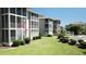 Well-maintained condo building with green lawns and landscaped shrubs in the community at 1900 Duffy St. # L-5, North Myrtle Beach, SC 29582