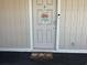 Condo front door with beach themed decorations and a 'Beach House' doormat at 1900 Duffy St. # L-5, North Myrtle Beach, SC 29582