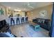 An open living space with bar seating, a sofa, and coastal-themed decorations at 1900 Duffy St. # L-5, North Myrtle Beach, SC 29582