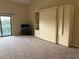 Neutral bedroom with a murphy bed and sliding glass door to balcony at 1930 Bent Grass Dr. # 39H, Surfside Beach, SC 29575