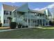 Inviting two-story condo with charming porch and well-maintained landscaping at 1930 Bent Grass Dr. # 39H, Surfside Beach, SC 29575