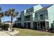 Exterior view of a multi-story building with screened porch and upper-level balconies at 1930 Bent Grass Dr. # 39H, Surfside Beach, SC 29575