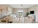 Bright living room with a neutral color palette and sliding doors to the backyard at 208 Warner Crossing Way, Loris, SC 29569