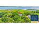 Aerial view of a property surrounded by lush greenery, close to Belle Isle Yacht Club memberships at 21 Whitehall Ave., Georgetown, SC 29440