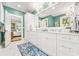 Well-lit bathroom with double vanity and marble floors at 21 Whitehall Ave., Georgetown, SC 29440