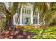 Elegant two-story home with a welcoming front porch, stately white columns, and beautiful greenery at 21 Whitehall Ave., Georgetown, SC 29440