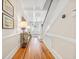 Bright foyer boasts hardwood floors, paneled walls, staircase, and a clear view to the front door at 21 Whitehall Ave., Georgetown, SC 29440