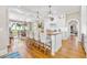 Gourmet kitchen with a large island, bar seating, and open layout into the dining area with water views at 21 Whitehall Ave., Georgetown, SC 29440