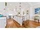 Spacious kitchen island with seating, pendant lights, and built-in appliances, creating a chef's paradise at 21 Whitehall Ave., Georgetown, SC 29440