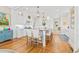 Bright kitchen with large island, seating, and white cabinets providing a stylish cooking space at 21 Whitehall Ave., Georgetown, SC 29440