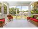 Charming screened porch with wicker furniture and a peaceful view of the lush, green backyard at 21 Whitehall Ave., Georgetown, SC 29440