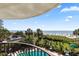 Balcony showcasing a stunning ocean view, pool, beach, palm trees, and lounging area at 2500 N Ocean Blvd. # 102, Myrtle Beach, SC 29577
