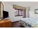 View of a bedroom with a queen size bed and curtains with a beach scene and vintage furnishings at 2500 N Ocean Blvd. # 102, Myrtle Beach, SC 29577
