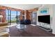 Cozy living room with sofa, chairs, television, glass table, and balcony offering ocean views at 2500 N Ocean Blvd. # 102, Myrtle Beach, SC 29577