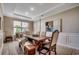 Elegant dining room features a large wooden table, upholstered chairs, and decorative lighting at 251 Copper Leaf Dr., Myrtle Beach, SC 29588