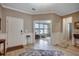 Elegant entryway with wood-look floors, wainscoting, and views into the adjacent living spaces at 251 Copper Leaf Dr., Myrtle Beach, SC 29588