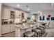 Stylish kitchen featuring white cabinets, granite countertops, a large island, and modern appliances at 251 Copper Leaf Dr., Myrtle Beach, SC 29588