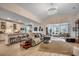 Open-concept living space with modern decor, a kitchen island with seating, and ample natural light at 251 Copper Leaf Dr., Myrtle Beach, SC 29588