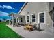 Inviting patio with pergola, features comfortable outdoor seating and dining area, perfect for entertaining at 251 Copper Leaf Dr., Myrtle Beach, SC 29588
