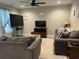 This cozy living room features a ceiling fan and two large TVs for entertainment at 2529 Suzanne Dr., Conway, SC 29526