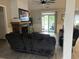 Relaxing living room with a stone fireplace, a large sliding glass door, and neutral wall color at 2529 Suzanne Dr., Conway, SC 29526