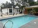 In-ground pool with a covered outdoor kitchen area; great backyard for relaxing and entertaining guests at 2529 Suzanne Dr., Conway, SC 29526