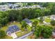 Aerial view of a home surrounded by mature trees and lush landscaping in a peaceful neighborhood setting at 260 Dunbarton Ln., Conway, SC 29526