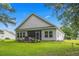 Spacious backyard with a screened-in porch and manicured lawn, perfect for outdoor living and entertaining at 260 Dunbarton Ln., Conway, SC 29526