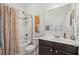 Well-lit bathroom featuring a shower-tub combo and a vanity with countertop space and modern fixtures at 260 Dunbarton Ln., Conway, SC 29526