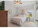 Cozy bedroom featuring a comfortable bed, ceiling fan, and a window offering natural light and a view at 260 Dunbarton Ln., Conway, SC 29526