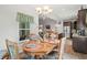 Cozy dining area with chandelier, and floral print dining set adjacent to the kitchen at 260 Dunbarton Ln., Conway, SC 29526