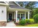 Welcoming front porch with charming seating and decorative accents creating a cozy curb appeal at 260 Dunbarton Ln., Conway, SC 29526