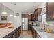 Spacious kitchen boasts granite countertops, stainless appliances, and an adjacent living area at 260 Dunbarton Ln., Conway, SC 29526