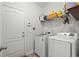 Functional laundry room with a washer, dryer, shelving for storage, and access to the exterior at 260 Dunbarton Ln., Conway, SC 29526