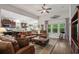 Open living area features hardwood floors, plush leather furniture, and natural light, ideal for relaxation and entertaining at 260 Dunbarton Ln., Conway, SC 29526