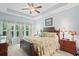 Comfortable bedroom featuring trey ceilings, a ceiling fan, and three large windows at 260 Dunbarton Ln., Conway, SC 29526