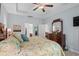 Primary bedroom suite with trey ceiling, wooden furniture, and soft, neutral décor at 260 Dunbarton Ln., Conway, SC 29526