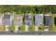 An aerial view of residences revealing landscaped lawns and driveways in a well-maintained neighborhood at 284 Whipple Run, Myrtle Beach, SC 29588